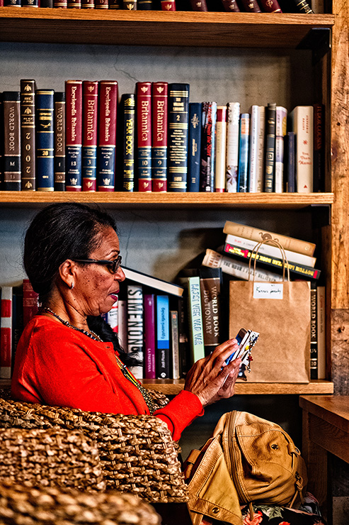 Woman on phone in library