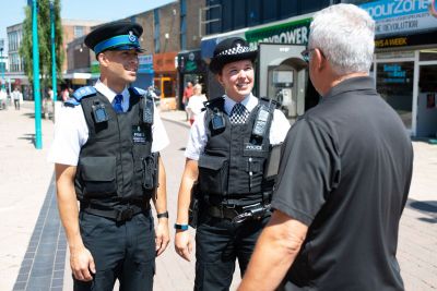 Police officer with citizen in town