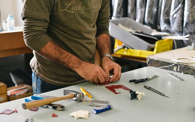 A man working in a tool shed