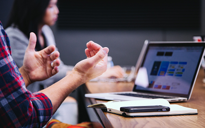 Image showing someone presenting to a laptop