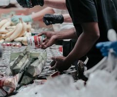 Man looking through used packaging