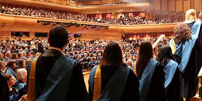 graduates looking across the auditorium