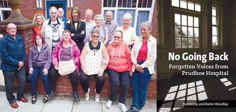 Members of Skills for People sitting on a wall and the No Going Back book cover