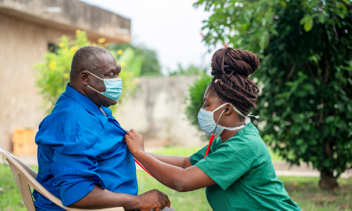 Care worker with patient wearing masks