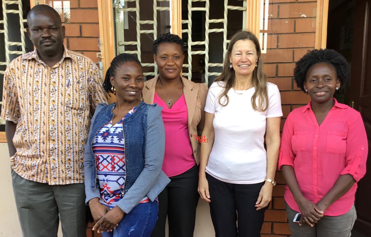 Photo of Commonwealth Scholars from earlier years with OU tutor 