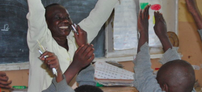 Image of teacher and children in classroom