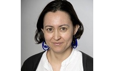 Photo shows Dr Helena Pérez Niño wearing a white top and a black cardigan