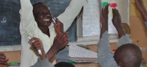 Image of teacher and children in classroom