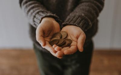 Hands holding coins