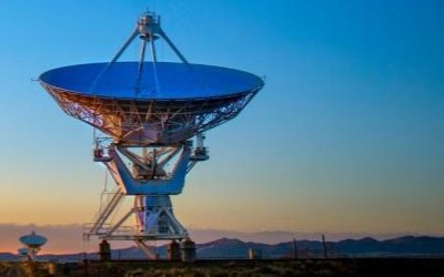 A photo of a telescope against blue sky