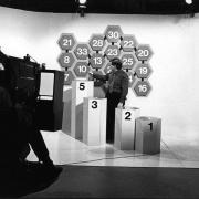 A man in a tv studio in the late 1960's