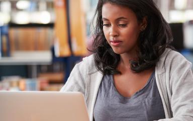Female student working in the library