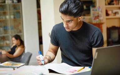Student working from home on their laptop