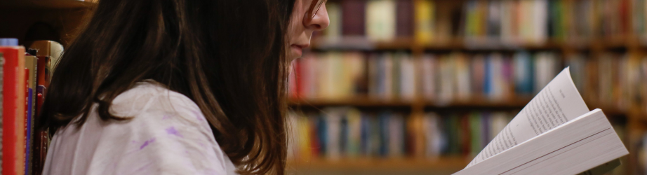 Student reading in the library