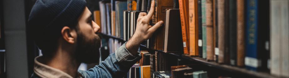 Student browsing books in the library