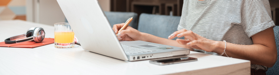 Student typing and making notes