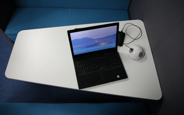 A laptop sitting on a table