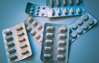 A picture of pill packets stacked on top of each other