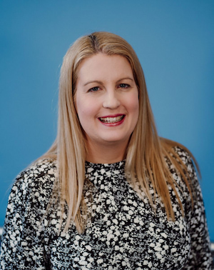 a picture of Nicola who has blonde hair and is smiling into the camera