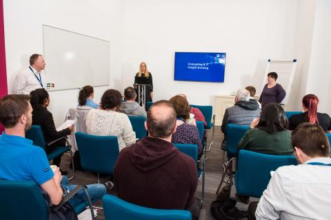  a room of people at an event