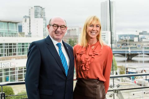 John D'Arcy and Caroline Casey stand and pose for a photo