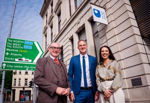 John D'Arcy, Peter Kyle and Michelle Laverty stand posing for a photo