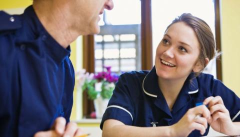 two nurses chatting to each other