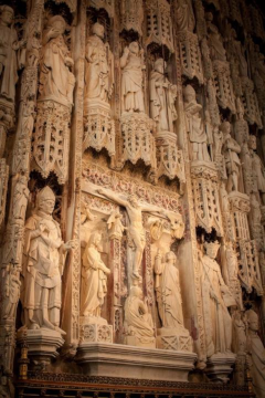 Ornate statues in the reredos, with the crucifixion in the centre.