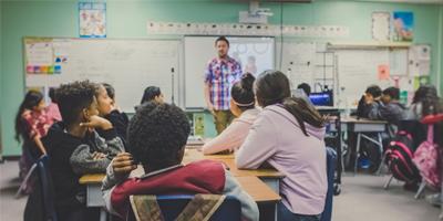 Teacher with pupils in classroom