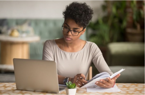 woman studying at laptop