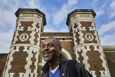 A photo of the author, Stephen Akpabio-Klementowski, stood outside of a prison