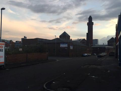 A prison building at dusk.