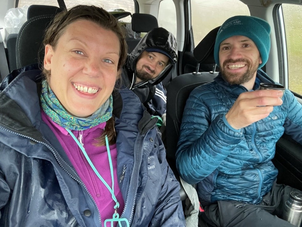 Three people in a minibus