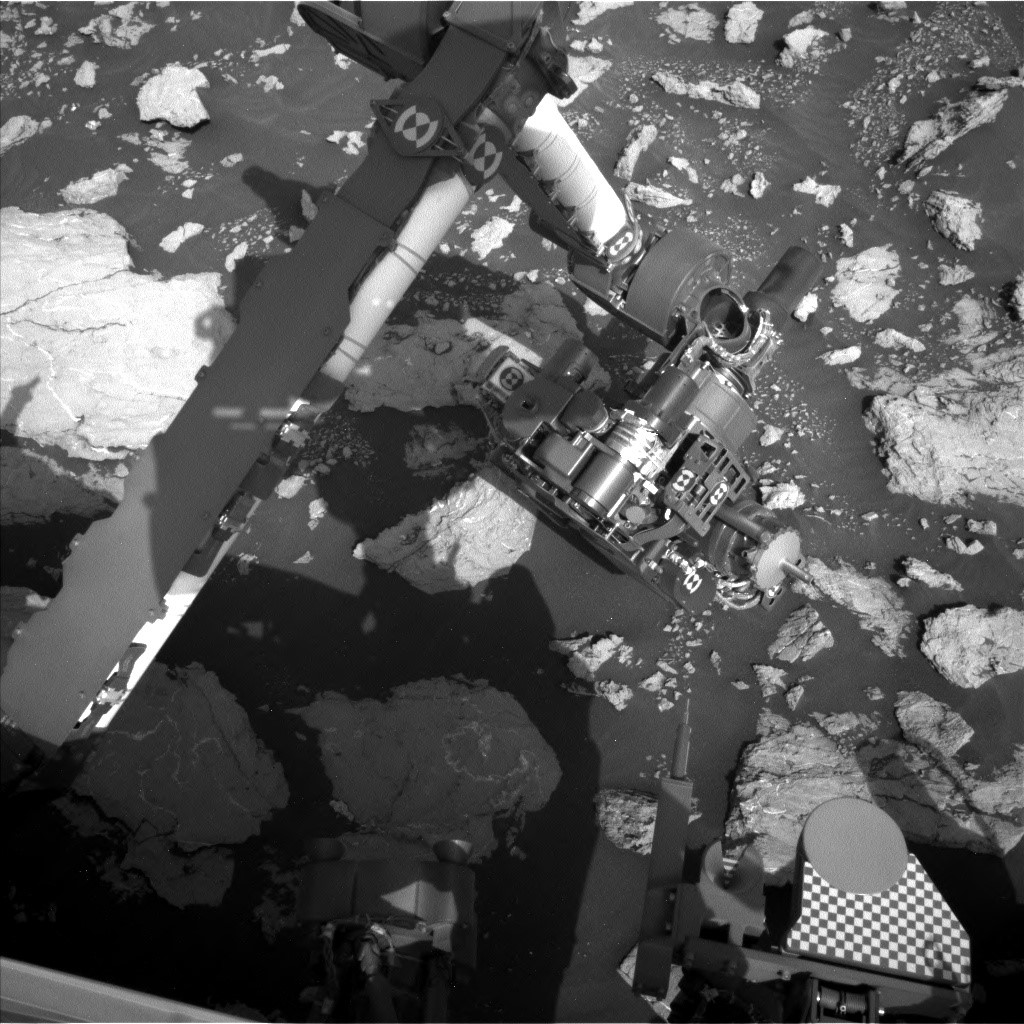 The left navigation camera looks down on the arm while it operates in the workspace