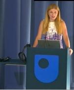 Karen Olsson-Francis standing at the podium introducing the day