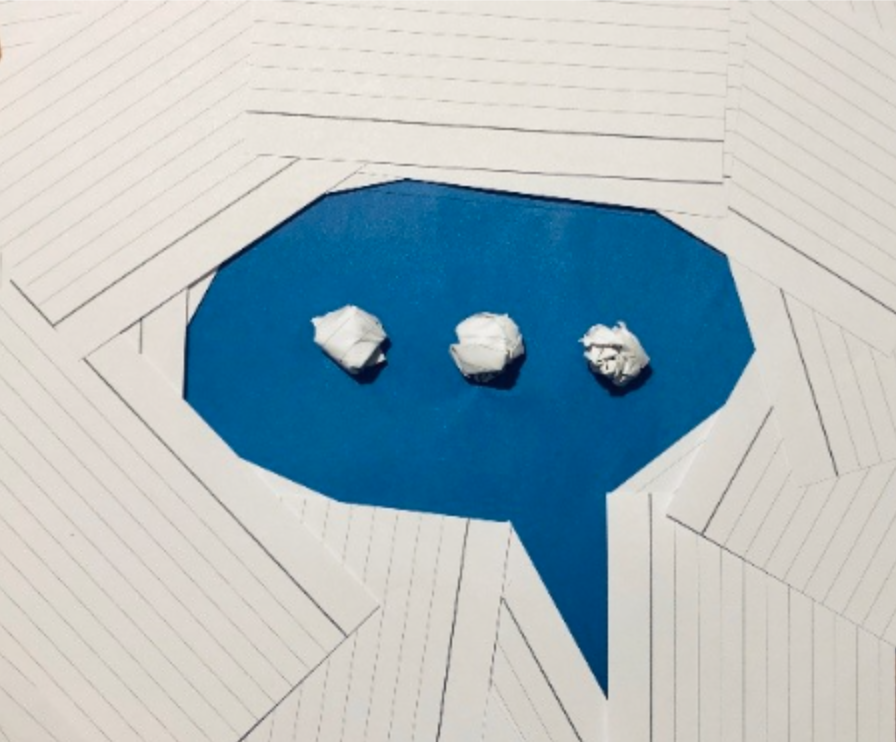 The outline of a speech bubble made up of lined paper