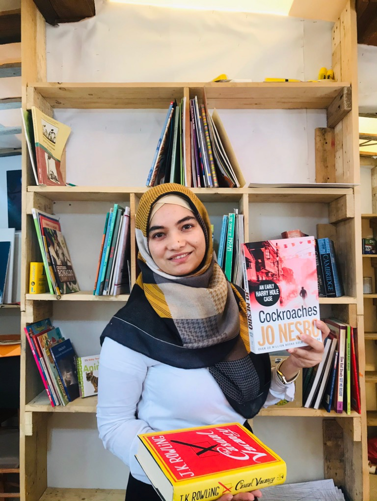 Parwana Amiri holds a book in her hand