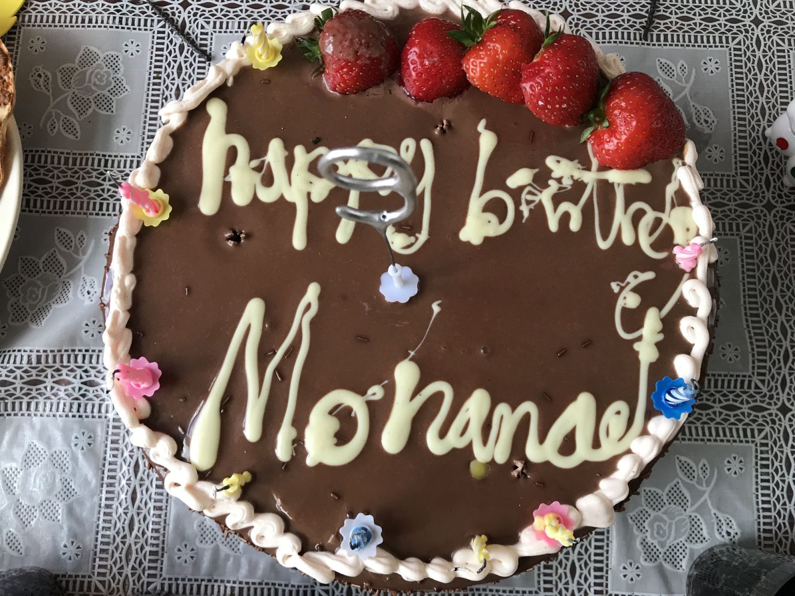 A chocolate cake with strawberries on