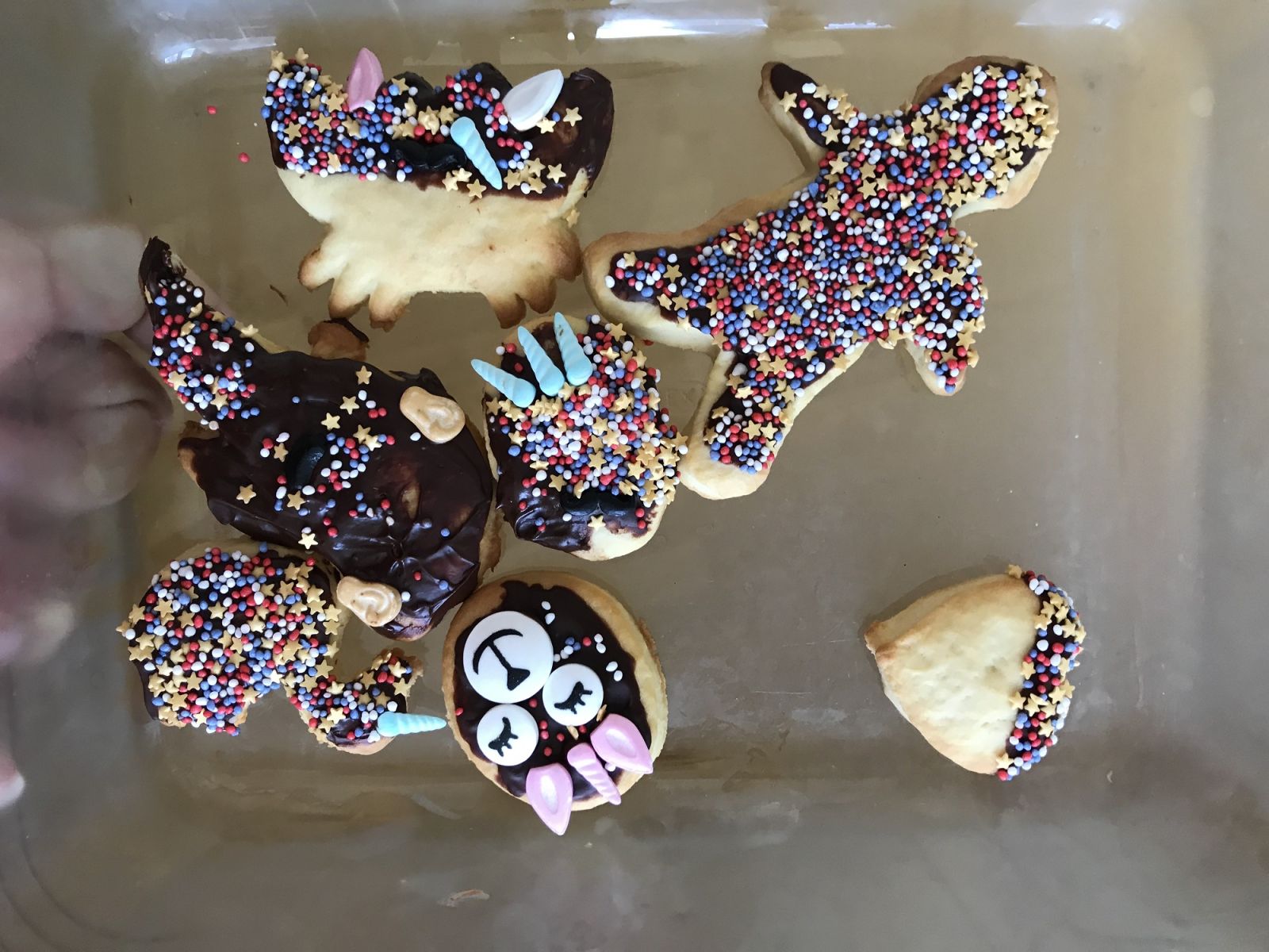 A selection of baked biscuits and cookies covered in colourful icing