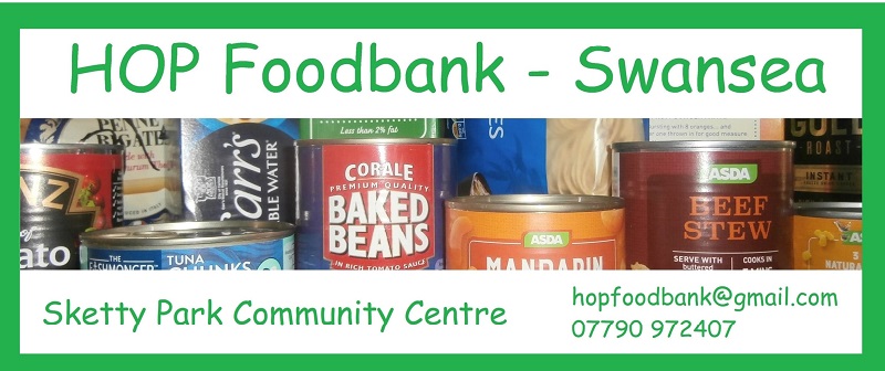The promotional poster for the food bank is shown with images of tins and food