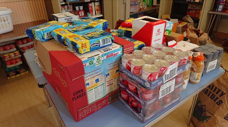 Crates filled with items are shown on a table