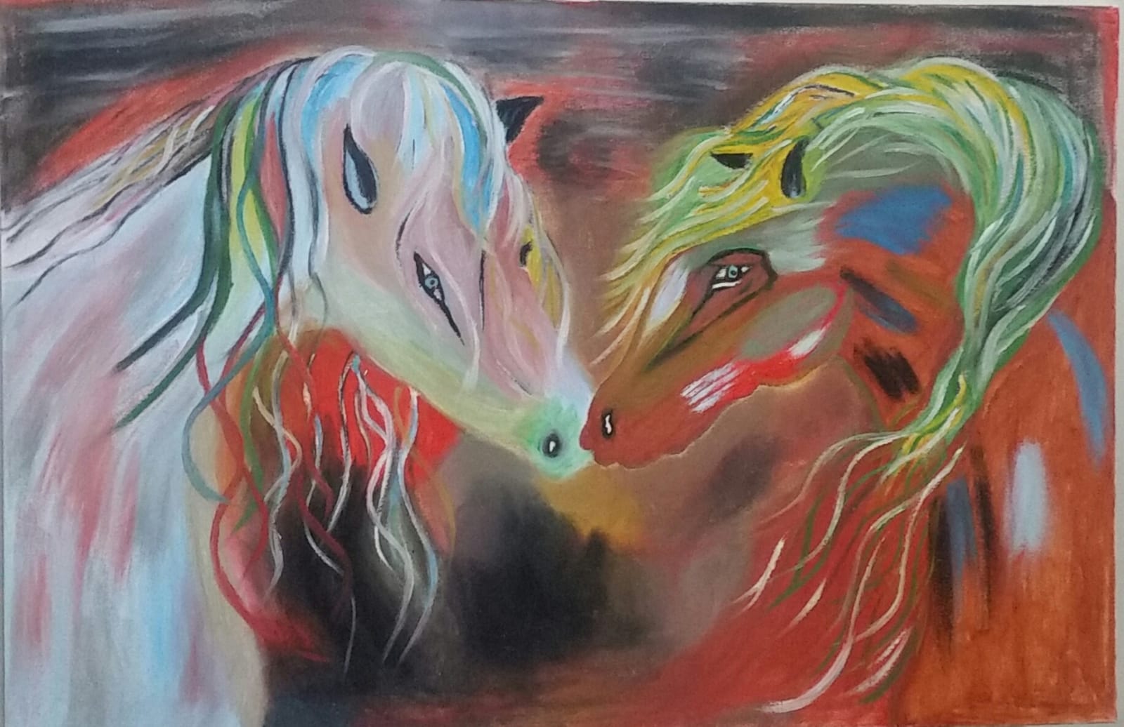 Two colourful horses with long manes rest their heads towards each other