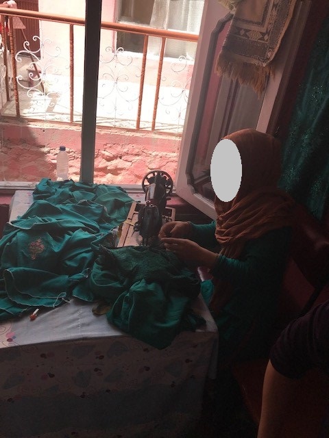Afghanistan women sewed clothes with hand and sewing machine
