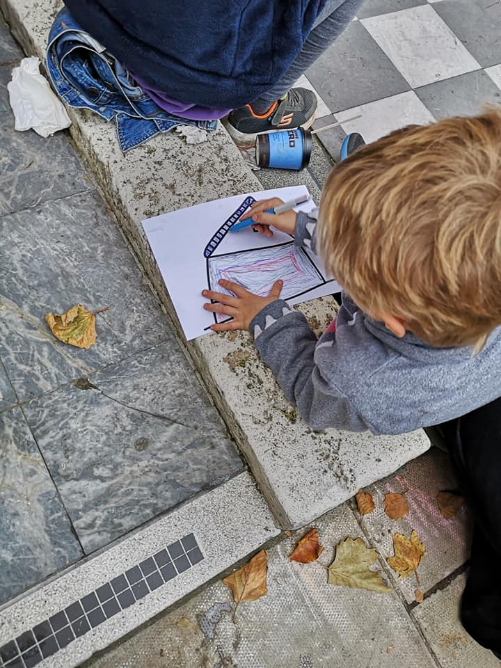 Humanity Knows No Borders Or Nationality: a boy draws picture