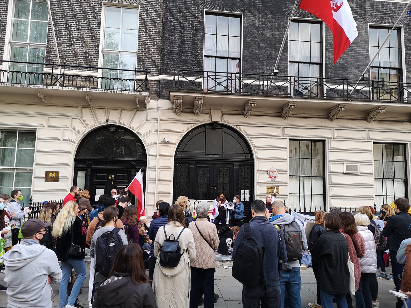 Humanity Knows No Borders Or Nationality: people gather together to support