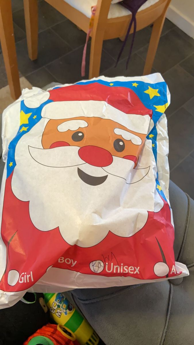 Child playing with Christmas goodies