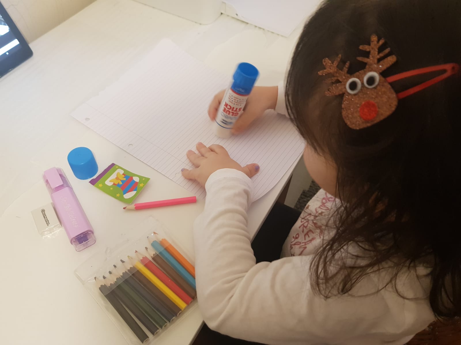 Child playing with Christmas goodies