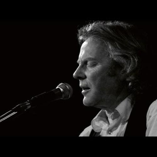Reg Meuross, an English singer and songwriter, performing
