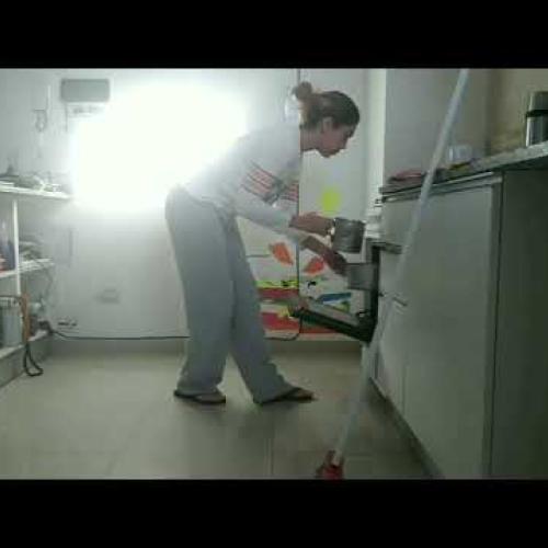 Lady opening oven