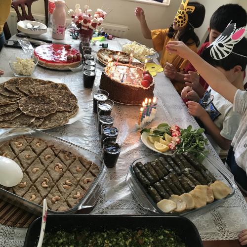 A table filled with delicious-looking foods is prepared